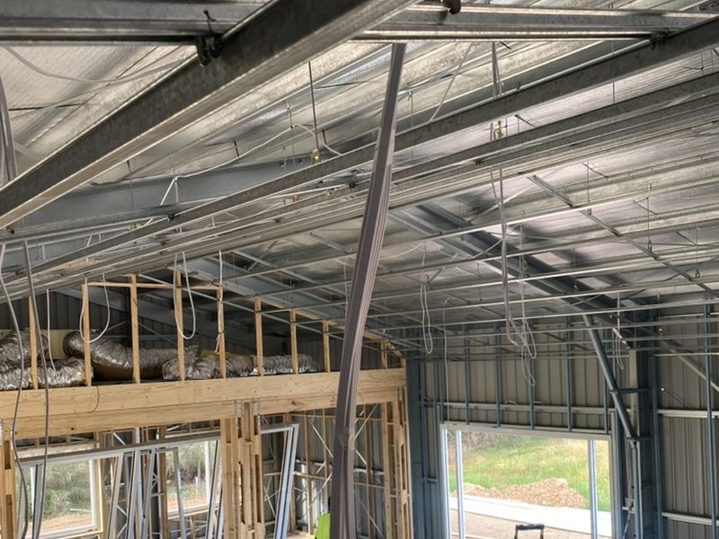 Cable tray and conduit installation during 1st fix on a luxury Adelaide new build